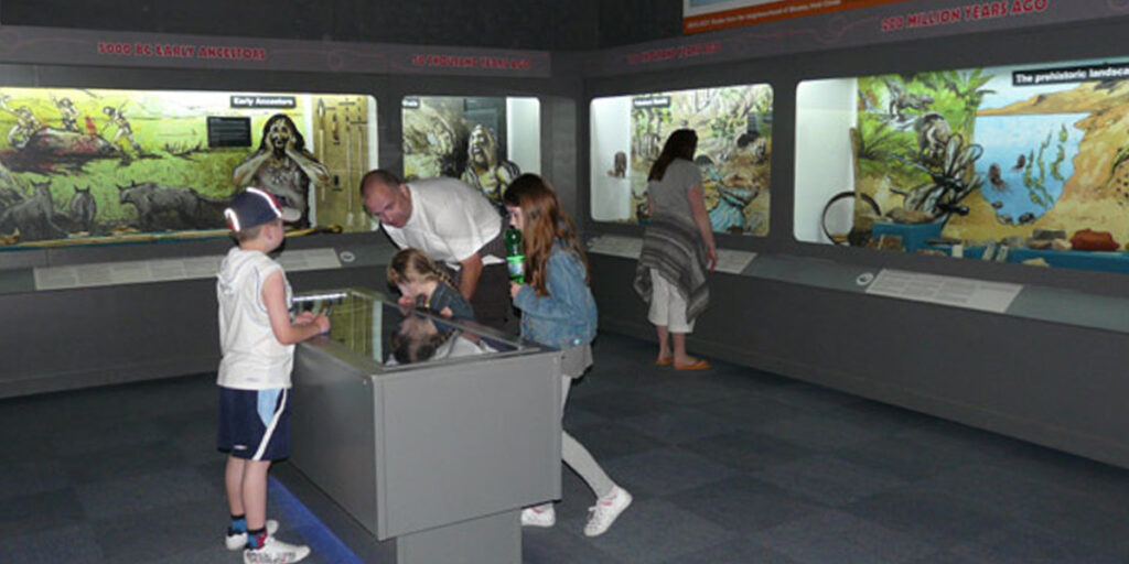 A family enjoying a visit to the Wookey museum.